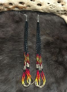 Authentic Beautiful Native American Indian Jewelry Navajo Hand Beaded Long Dangle Earrings. Great for a gift❤️ Handcrafted by Navajo Artist R. Sellers These beautiful earrings are 10" in length and 1" in width. Southwestern Dangling Beads For Jewelry Making, Southwestern Style Multicolor Jewelry With Black Beads, Southwestern Style Handwoven Dangle Jewelry, Southwestern Black Beaded Dangle Earrings, Southwestern Style Beaded Earrings For Festival, Adjustable Southwestern Black Earrings, Southwestern Style Black Earrings With Colorful Beads, Southwestern Style Black Beads Jewelry For Gift, Southwestern Style Black Bead Jewelry For Gifts