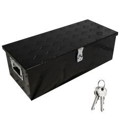 the trunk is black and has two keys in it, with a lock on each side