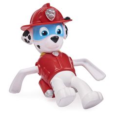 a toy fireman dog laying on the ground