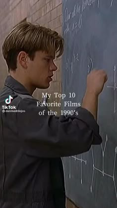 a young man writing on a blackboard in front of a brick wall with the words, my top 10 favorite films of the 1990s's