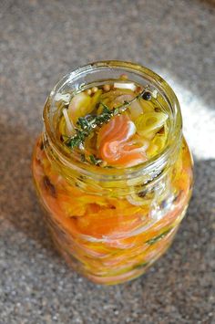 a glass jar filled with food sitting on top of a table