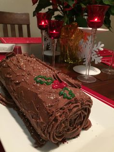 a large piece of chocolate cake sitting on top of a white plate