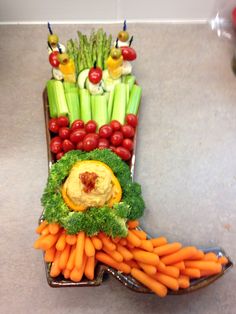 a platter filled with carrots, celery and other veggies