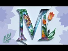 the letter m is made up of paper flowers and leaves on a white background with blue, purple, green, yellow and orange colors