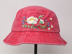 Item: flower embroidered bucket hat Material: 100% cotton Size: one size fits most Color: white, message me if you want to customize the pattern to another color Free first class shipping, upgradable priority mail service. 30 days return policy, feel confident at your purchase! Pink Cotton Hat For Spring, Pink Cotton Bucket Hat For Spring, Adjustable Pink Cotton Bucket Hat, Pink Cotton Bucket Hat With Curved Brim, Red Adjustable Cotton Bucket Hat, Adjustable Red Cotton Bucket Hat, Vintage Cotton Sun Hat With Short Brim, Vintage Cotton Sun Hat, Vintage Cotton Bucket Hat