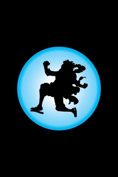 a black and blue circle with a silhouette of a man riding a skateboard in the air