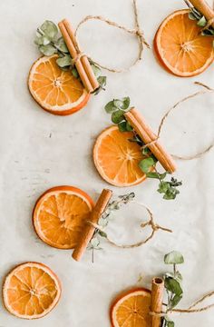 orange slices and cinnamon sticks tied to twine