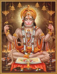 the hindu god is sitting in front of an open book with candles on it and his hands