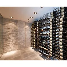 a wine cellar filled with lots of bottles