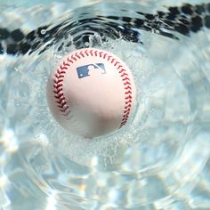 a baseball is floating in the water