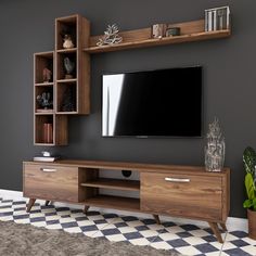 an entertainment center with a large television on it's side and shelves above the tv