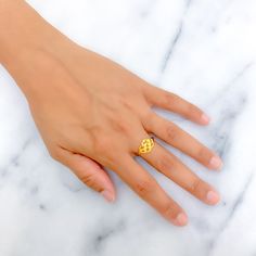 This 22k gold ring features a modish fancy design, perfect for adding elegance to any outfit. Weighing 2.0 grams, it showcases a yellow gold finish that enhances its stylish and modern appearance. Sized at 7.25, with resizing available, this ring combines style and practicality, making it ideal for daily wear or special occasions. Suitable for those who appreciate fashionable and refined jewelry, this ring brings a touch of luxury and fancy charm to your collection. PRODUCT DETAILS Gold Purity(karat): 22k Gold Weight(grams): 2.0 Item Finish: Yellow Gold Ring Size: 7.25 Ring Sizing Available: Yes 22k Gold Toe Rings In Yellow Gold, 22k Yellow Gold Toe Rings, Yellow Gold 22k Toe Rings, 22k Gold Open Ring, 22k Gold Promise Ring, Yellow 22k Gold Rings, 22k Gold Ring, Indian Rings, Bridal Jewelry Necklace