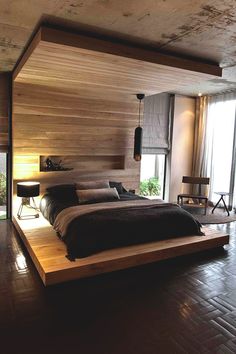 an instagramted photo of a bed in a room with wooden floors and walls