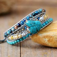 Boho Turquoise Wrap Bracelet Add a touch of Bohemian charm to your style with this exquisite Boho Turquoise Leather Wrap Bracelet! Handcrafted from genuine leather with turquoise stones. This lovely turquoise bracelet emits wonderful vibrations that can fill you with tranquility and help open your heart to feelings of universal love. It promotes positive thinking and increases feelings of joy and optimism throughout the day. Wear it as an everyday reminder of your positive intentions. Combined w Crystal Making, Turquoise Wrap Bracelet, Wrap Armband, Handmade Leather Jewelry, Bohemian Beauty, Boho Turquoise, Treasure Jewelry, Boho Wrap Bracelet, Turquoise Boho