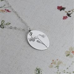 The December birth flower commonly represents purity, sweetness, and simplicity. The narcissus flowers are also often associated with respect and faithfulness. This hand-drawn design is simple enough for everyday wear. This custom necklace is a perfect gift for Grandma, Mom or Daughter on her Birthday, for Christmas or Mother's Day. *Charm: 13mm by 18mm *Chain Selection: 16-24 inch *Handcrafted from sheet metal with secure connections *Choice of Satin Finish Sterling Silver, 14/20 Rose Gold Fill Elegant Dangle Birth Flower Jewelry, Minimalist Sterling Silver Birth Flower Necklace, Silver Birth Flower Necklace For Mom, Minimalist Birth Flower Jewelry For Mother’s Day, Silver Birth Flower Necklace, Silver Or Gold Jewelry, Narcissus Flowers, December Birth Flower, December Birthday Gifts