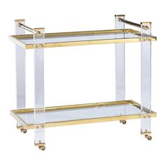 a gold and clear bar cart with wheels