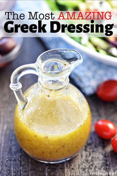 Glass bottle of Greek Salad Dressing with Greek salad ingredients in background. Greek Salad Dressing Recipe, Healthy Dressing Recipes, Mediterranean Diet Recipes Dinners, Salad Dressing Recipes Healthy, Greek Dressing, Greek Salad Dressing, Easy Mediterranean Diet Recipes, Salad Dressing Recipes Homemade, Greek Salad Recipes