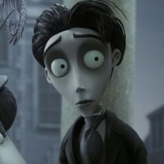 the animated character is dressed in black and has eyes wide open to look like he's looking at something