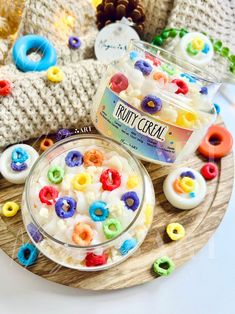 a bowl of cereal sitting on top of a wooden plate next to some knitted items