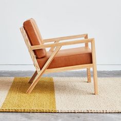 chair on a rug Leather Occasional Chair, 70s Furniture, Wooden Lounge Chair, School Of Architecture, Leather Chairs, Upholstery Foam, Gus Modern, House Things, Furniture Hacks