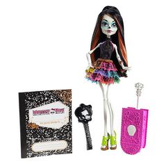 a doll with long hair and colorful dress next to a notepad, pen and key