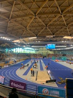 an indoor track and field in a stadium