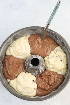 a cake pan filled with chocolate and white frosting