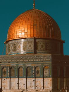 an old building with a golden dome on top