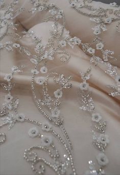 "Luxury embroidered lace fabric for wedding gown. Lace fabric with overlaid elements. 3D effect lace is a fabric of incredible magic. Delicate design with small flowers, embellished with beads and sequins. Such fabric will help to bring to life a completely graceful and sensual image of the bride. Lace width( 53\") 1.35 m. The price is for: 1) 0.5 yard - 82$ 2) 1 yard - 155$ Composition: 50% nylon, 50% polyester Width 1.35 (53 \") You can pick up the buttons in the color of the fabric here: http Luxury Embroidered Fabric For Reception, 3d Lace Fabric, Elegant Floral Embellished Lace Fabric, Elegant Organza Fabric With 3d Embroidery, Wedding Dress With 3d Embroidery In Organza, Elegant Tulle Fabric With 3d Lace Embroidery, Wedding Lace Fabric With Floral Embroidery, White Pearl Embroidered Fabric For Banquet, Elegant White Embroidered Fabric With 3d Embroidery