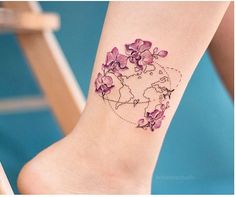 a map with flowers on it and the world in the middle is marked by a line