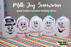 five milk jug snowmen are lined up on a table with the words, great indoor / outdoor holiday decor