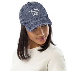 Gear up for your next adventure with the Sardis Lake Hat! This unisex cap features a vintage wash and embroidered design, adding a touch of denim inspired style to your look. With an adjustable strap, it's a perfect fit for all your travels - whether you're hitting the lake or exploring new destinations. The details: Low profile dad hat 100% superior cotton twill 6-panel unstructured, soft crown 6 sewn eyelets Black sweatband Metal snap buckle with an antique brass finish Washed-out vintage effe Vintage Cap, 90s Grunge, Embroidered Hats, Dad Caps, Special Thanks, Embroidery Details, Vintage Cotton, Embroidered Design, Rhode Island