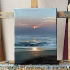 an oil painting on canvas of a sunset over the ocean