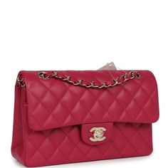 This small Classic Double Flap bag is in dark pink caviar leather with light gold tone hardware and features a front flap with signature CC turnlock closure, half moon back pocket, and adjustable interwoven light gold tone chain link and dark pink leather shoulder strap.The interior is lined in dark pink leather with the "love letter" zipper compartment underneath the first flap, an "outer" slit pocket under the second flap, and an interior compartment with two open pockets separated by a "lipstick" compartment.Collection: 21AOrigin: FranceCondition: New and never worn (plastic on hardware)Accompanied by: Chanel box, Chanel dustbag, carebook, ribbon and feltMeasurements: 9" width x 5.25" height x 2.5" depth; 16.5" strap drop (9.5" doubled) Pink Chanel Bag, Chanel Box, Pink Chanel, Backpack Tote Bag, Carry All Bag, Tote Backpack, Flap Bag, Pink Leather, Half Moon