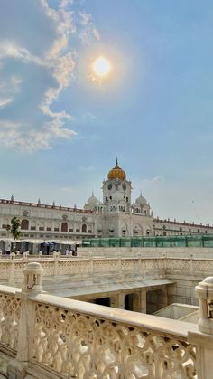 the building is white and has a golden dome