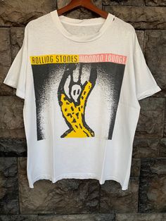 "Vintage 90s ROLLING STONES Voodoo Lounge World Tour By Levis Rock White distressed Tshirt Item Condition: Pre-Owned (Used) condition. please see pictures Size on Tag: L, Please check measurement Tag : missing ------------ Measurement: ------------- Chest (Pit to Pit) 21.5\" Length 26\" Shipping: Worldwide ---------- Standard Shipping 14-30 Days Express 5-8 Days I can do combined shipping +Add USD 5 shipping for each additional items!" Distressed Tshirt, T Shirt Photo, Cool Sweaters, 8 Days, Mens Graphic Tee, Vintage Sweatshirt, Fancy Dresses, Rolling Stones, World Tour