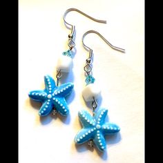 Detailed Aqua Blue Ceramic Starfish Focals Accented By White Coral Nuggets And Aqua Crystal Beads. Width .75”. Length Incl. Silver Tone Hooks 2.1”. Blue Star Shaped Jewelry For Vacation, Star-shaped Summer Beach Jewelry, Blue Star Jewelry For Vacation, Blue Starfish Charm Jewelry For Summer, Blue Summer Jewelry With Starfish Charm, Summer Blue Starfish Charm Jewelry, White Starfish Charm Star Earrings, Blue Starfish Jewelry For Beach, White Star-shaped Earrings With Starfish Charm