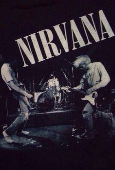 two men are playing guitars on stage with the words nirvana in white letters above them