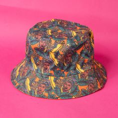 Add a dash of style and a sprinkle of soul to your accessories stash with our Reversible Bucket Hat. This isn't just any hat - it's a statement piece that lets you express your unique style, and love for the culture. On one side, you'll find a vibrant design that beautifully reflects and represents YOU. Flip it over, and you're greeted with a solid color green that complements any outfit. Available in six vibrant prints, this hat gives you two fabulous looks in one. Whether you're stepping out f Caribbean Queen, Seasonal Affective, For The Culture, Fall Tv, Reversible Bucket Hat, Giving Thanks, Black Authors, Women Boxing, Personalized Gifts For Kids