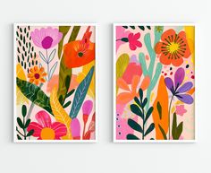 two framed art prints with colorful flowers and leaves on the same wall, one in bright colors