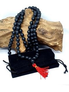 This mala is hand made from the rarest small shaligram stones picked from gandaki river in nepal.. Salagram sila stone is lord vishnu himself. There is residential of Goddess lakshmi,Saraswati,Ganesh and all god in that house where saligram is kept and worshipped. According to Shastras, wearing Shaligram ji benefits the family in 6 dimensions: Noble way of life, Wealth, Protection from evil, good health, worldly pleasures and blessing from Lord Vishnu  Wear as you see fit however predominantly u Traditional Wooden Beads Mala As Gift, Handmade Amulet Mala For Meditation, Traditional Black Mala With 108 Beads, Traditional Mala With 108 Beads As Gift, Handmade Black Mala For Meditation, Traditional Black Mala With 8mm Beads, Handmade Black Mala As Gift, Traditional Handmade Mala As Gift, Traditional Black Mala As A Gift