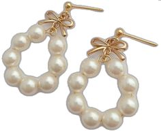 Dainty Pearl Earrings For Party, White Bow Earrings For Wedding, Wedding Pearl Drop Earrings With Bow, White Pearl Earrings With Bow For Wedding, Elegant White Pearl Charm Earrings, White Bow Pearl Drop Earrings, Gold Pearl Earrings With Bow For Gift, White Pearl Clip-on Earrings With Pearl Charm, Elegant White Clip-on Earrings With Pearl Charm