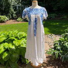 Vintage White & Blue Oaxacan Mexican Hand Embroidered Huipil Maxi Dress Flowers Tunic Vintage White With Blue Embroidered Flowers Oaxacan Mexican Hand Made Huipil Maxi Dress Tunic With Ruffled Skirt Hem. There Are A Few Stains In The Embroidery And One On The Front. They May Come Out, But I Have Not Tried. Measurements Taken Flat And Not Exact, Are Also Shown In Photos. Shoulder To Shoulder: 16" Neck To Hem: 45" Ruffled Skirt, Dress Tunic, Flower Dresses, Embroidered Flowers, Tunic Dress, Colorful Flowers, White Vintage, Hand Embroidered, White Blue