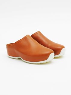 Balancing wearability with style and sustainability, these signature leather clogs were created in collaboration with Ecco. Inspired by the use of color, geometric silhouettes and respect for material that characterizes the Bauhaus movement, the contemporary look reinvents comfortable design. Crafted from calfskin that has been tanned using Ecco’s eco-friendly DriTan process, established to conserve water and eliminate waste, the durable and beautiful texture of the material remains. Exclusive F Bauhaus Movement, Conserve Water, The Bauhaus, Rosetta Getty, Platform Clogs, Denim T Shirt, Leather Clogs, Beautiful Textures, Toffee