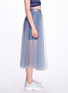 The Anne Skirt is a faultless tea-length addition to a layered look, featuring tiered weightless tulle, and a wide elastic waistband creating a high rise look. This is an extremely versatile garment; it is perfect for dance-related exercise, such as barre, or dance classes, and can also be worn as an everyday skirt, paired with running shorts or leggings. The sheer, tulle material and zen blue color adds a romantic and graceful element to this garment that extends its wear outside the gym. Everyday Skirt, Blue Tulle Skirt, Everyday Skirts, Tea Length Skirt, Tulle Material, Gown Skirt, Dance Classes, Sheer Skirt, Blue Tulle