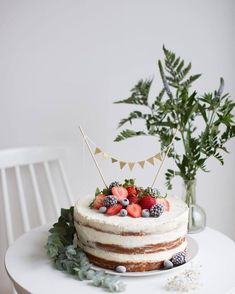 a cake sitting on top of a white table