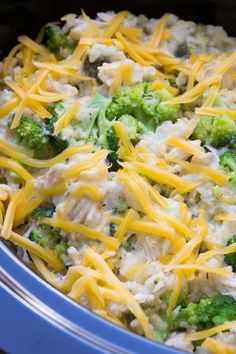 a casserole dish with broccoli, cheese and chicken in the crock pot