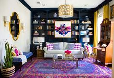 a living room filled with furniture and lots of bookshelves on top of it