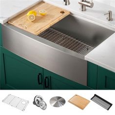 a stainless steel kitchen sink with cutting board and strainer