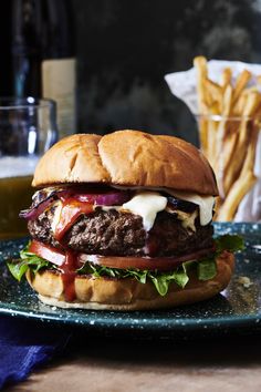 a cheeseburger on a plate with fries